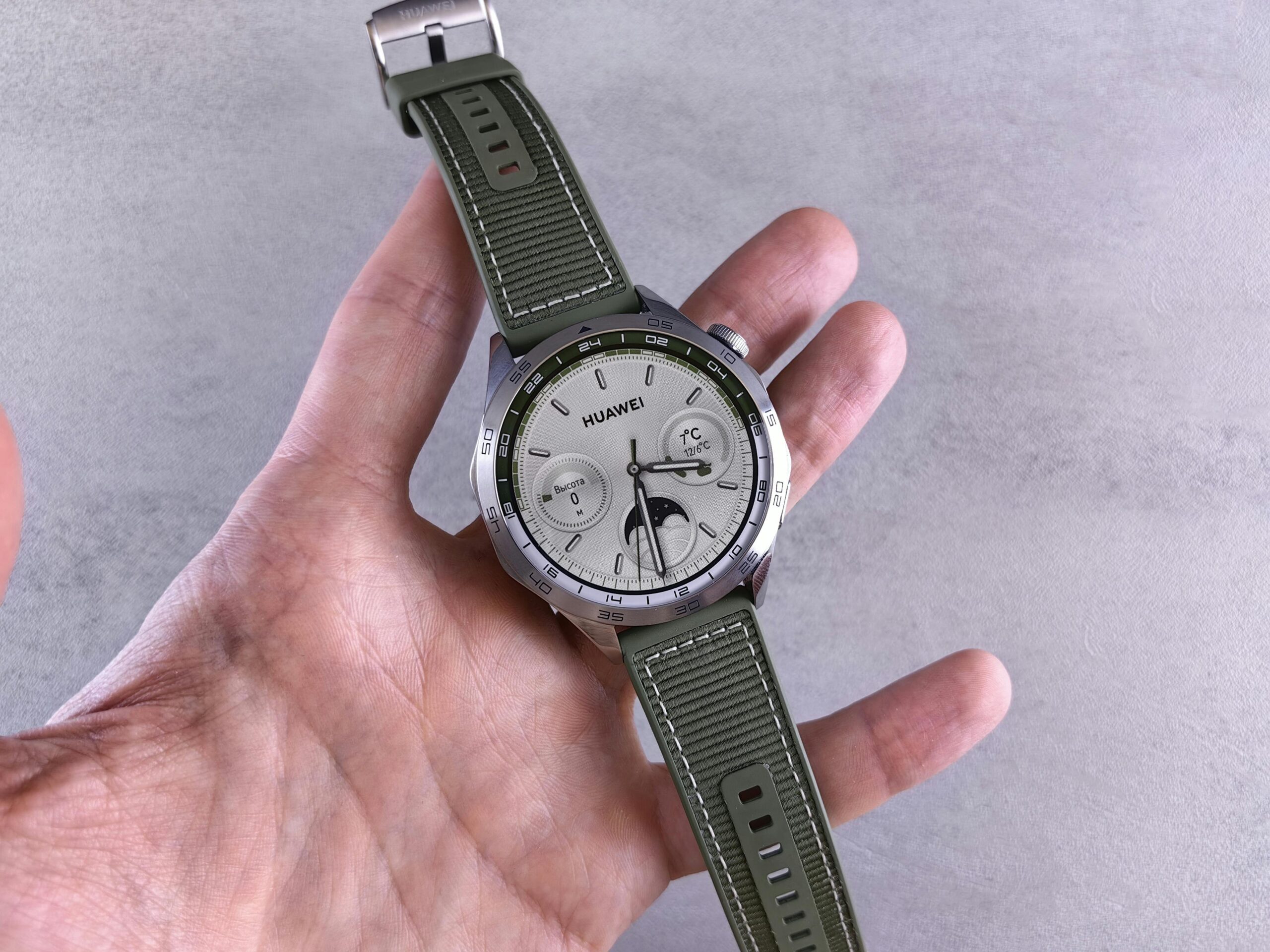 A sleek silver limited-edition smartwatch on a leather band
