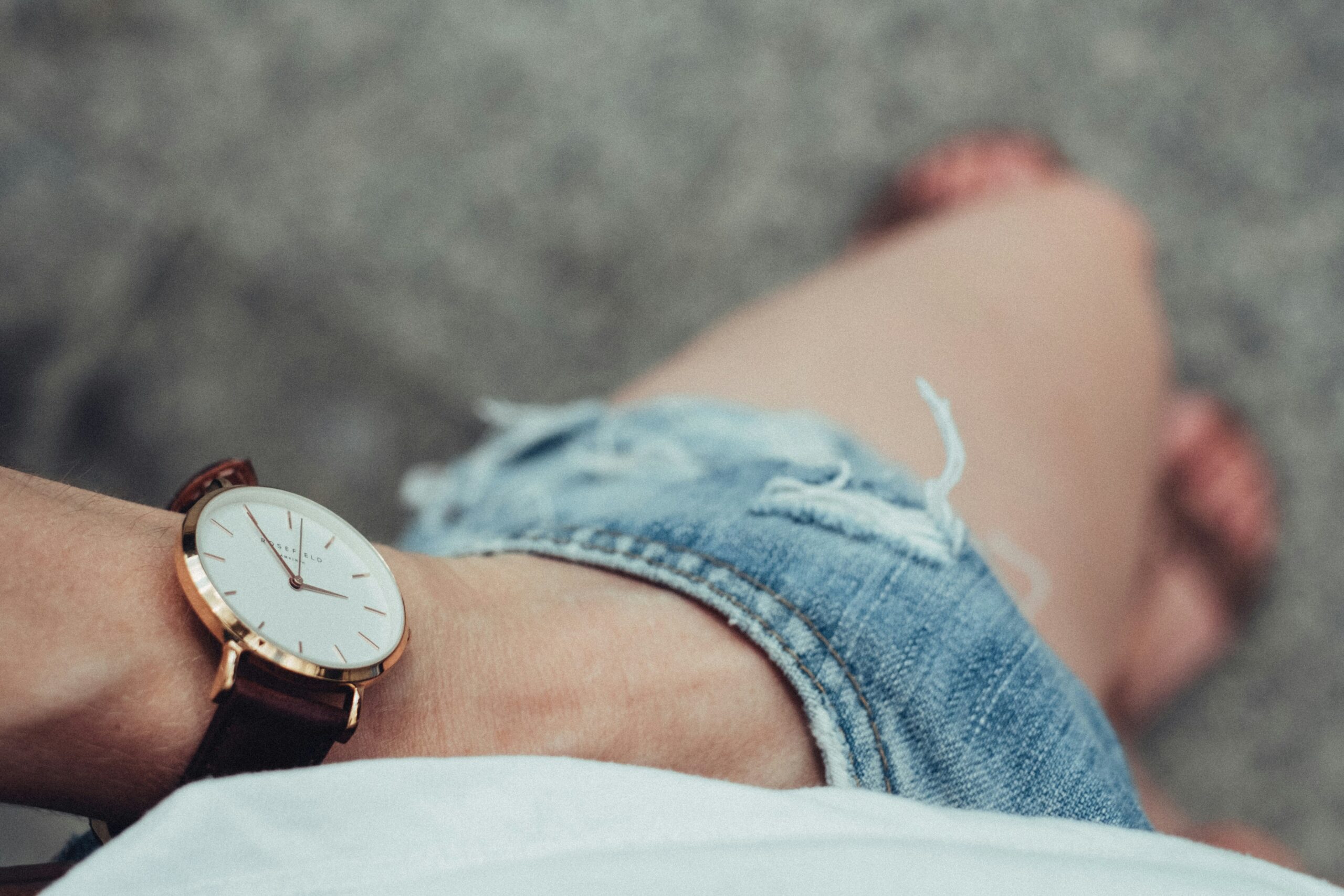 Before and after photos of Sarah showcasing improved style with a new stainless steel watch
