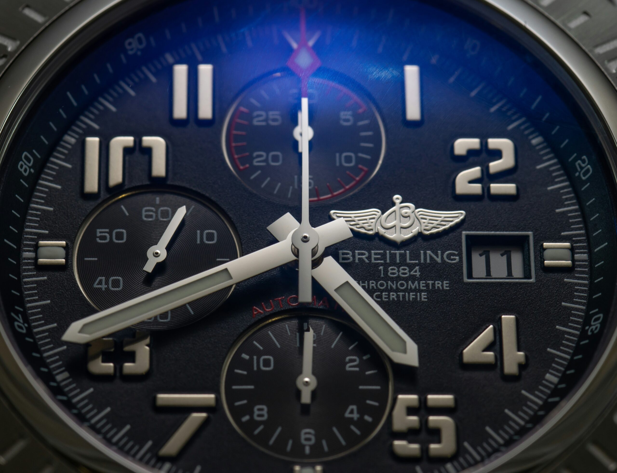 Bar graph comparing price ranges of various Omega models based on materials and features.