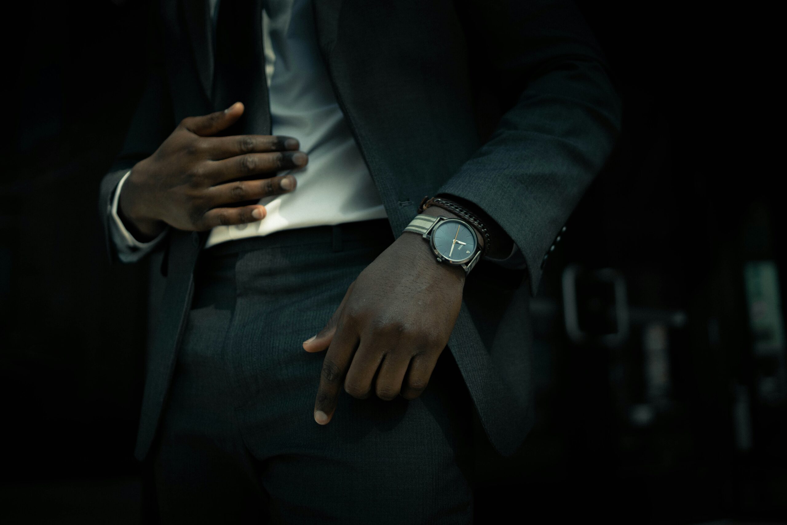 Person selecting a bronze watch from display case