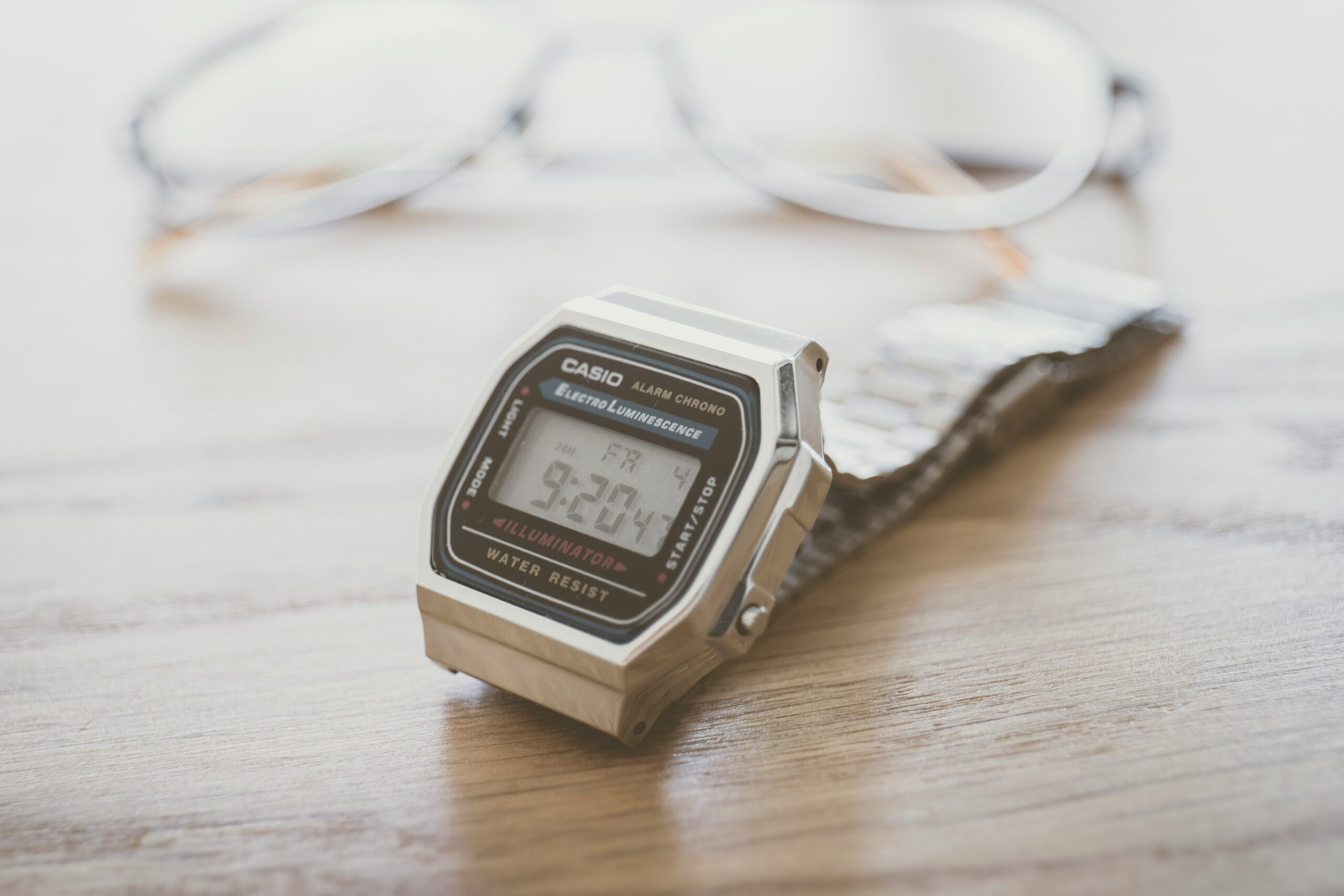 Three iconic bronze watches displayed side-by-side