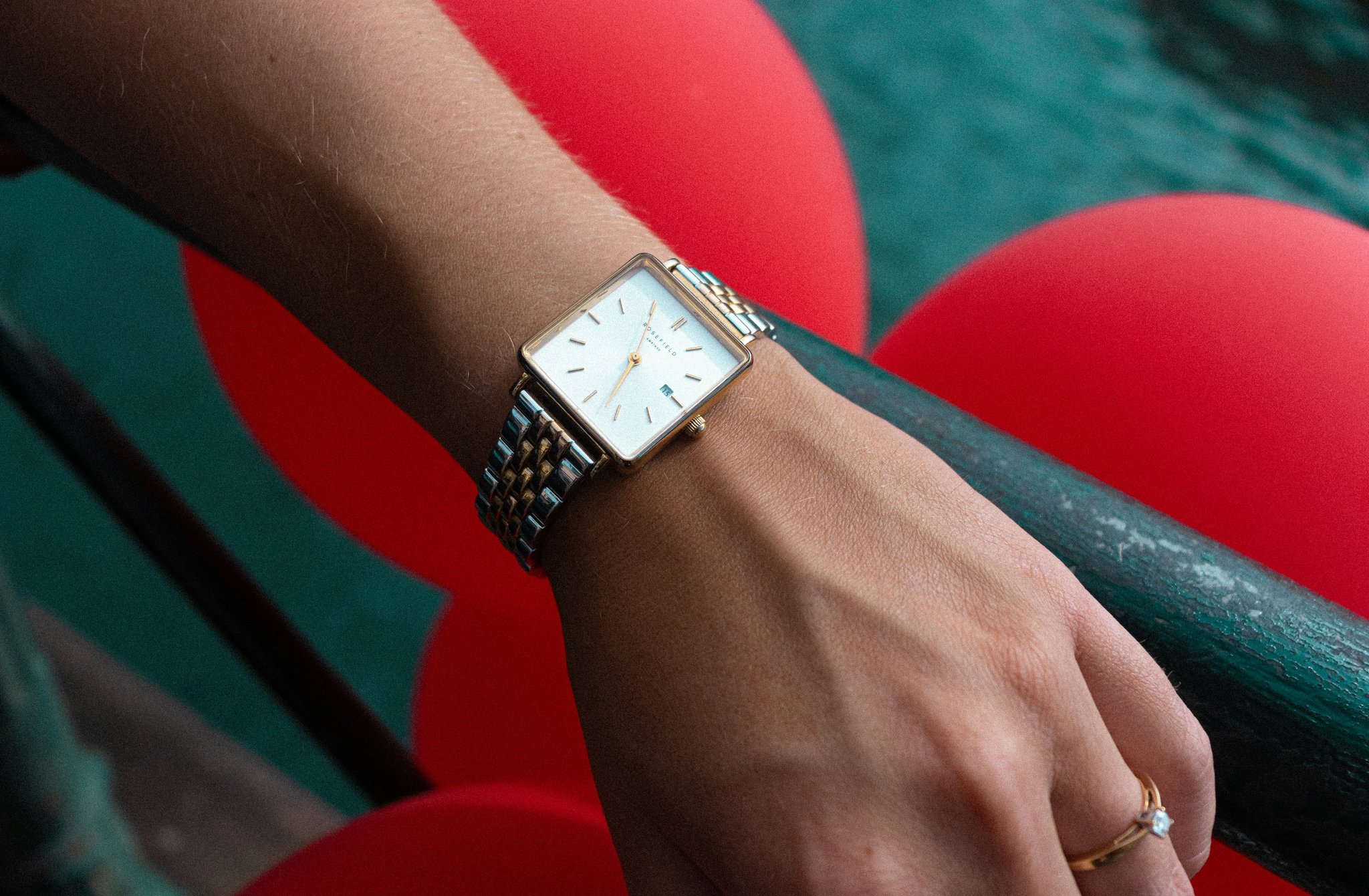 Woman wearing a sleek Just Cavalli smartwatch paired with office attire