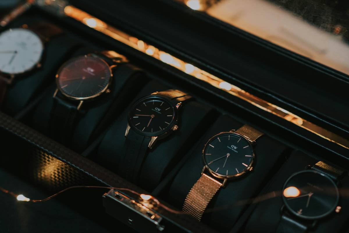 A professional woman confidently walking through an office lobby wearing CK smartwatch