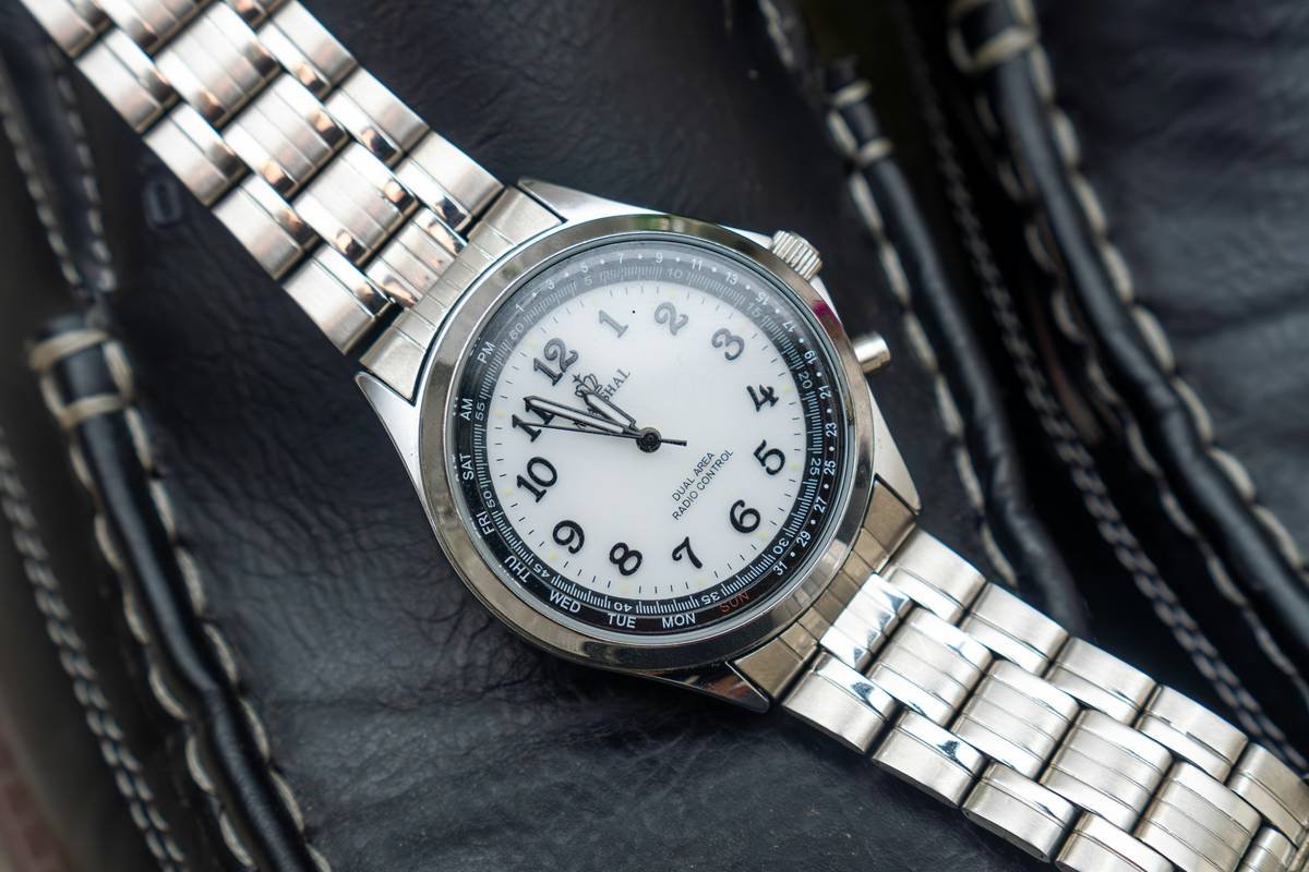 Graphic designer wearing a Stuhrling automatic watch