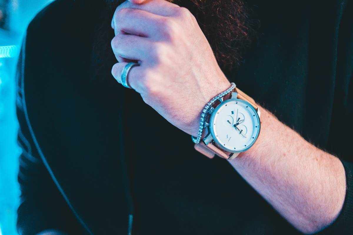 Portrait of satisfied customers wearing premium watches