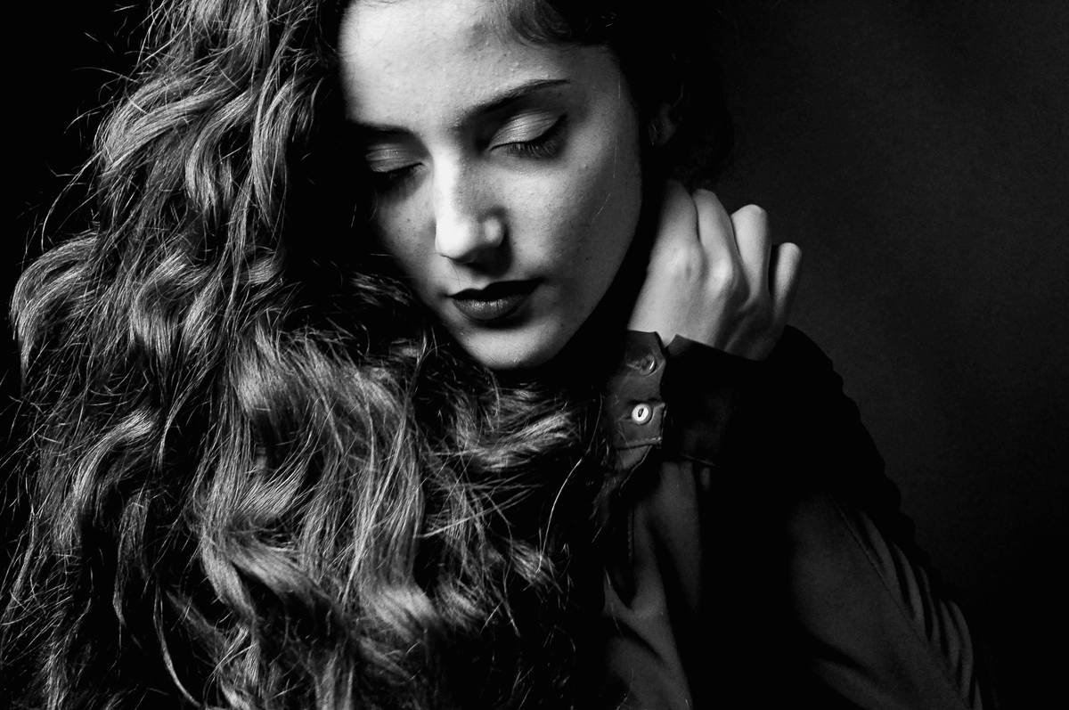 A man wearing a classic chronograph watch with a business-casual outfit.