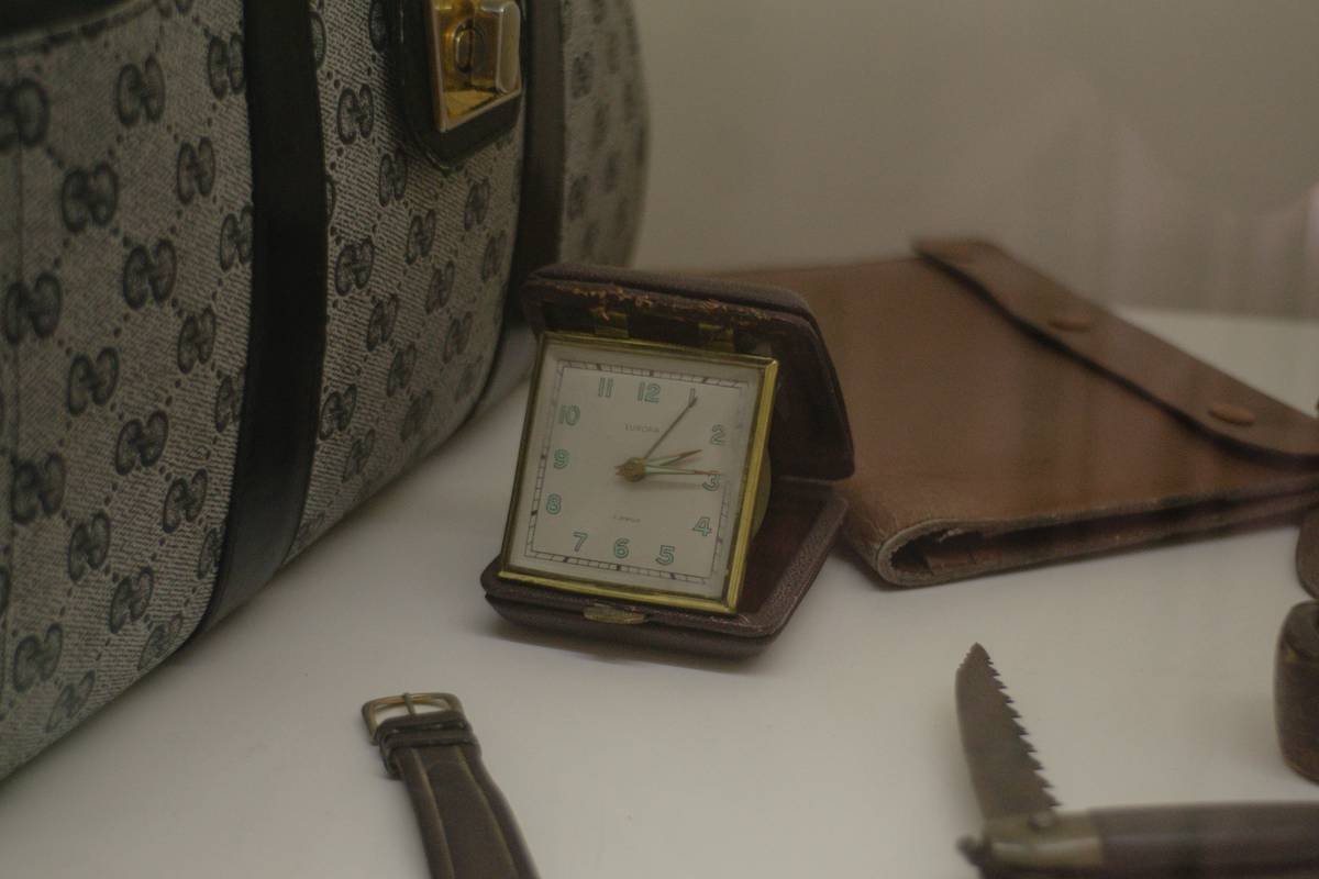 A collection of vintage sports watches displayed neatly on a wooden table