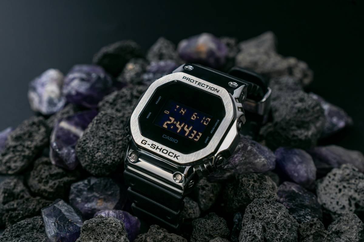 Collage of celebrity hands wearing fashionable watches with unique dial textures.