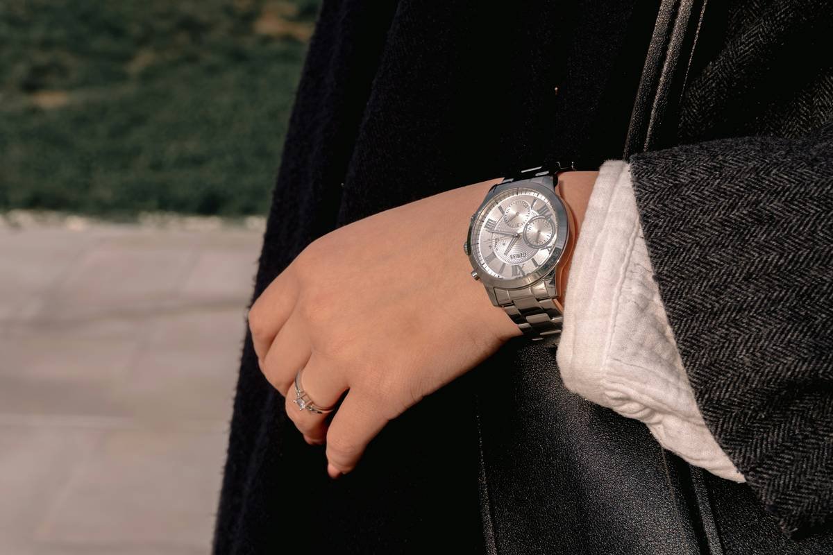 Infographic showing proper watch placement on wrist based on size and style