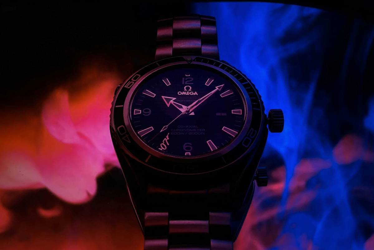 Kenzo x Felipe Pantone 2018 collaboration watch showing iridescent geometric dial and stainless steel case