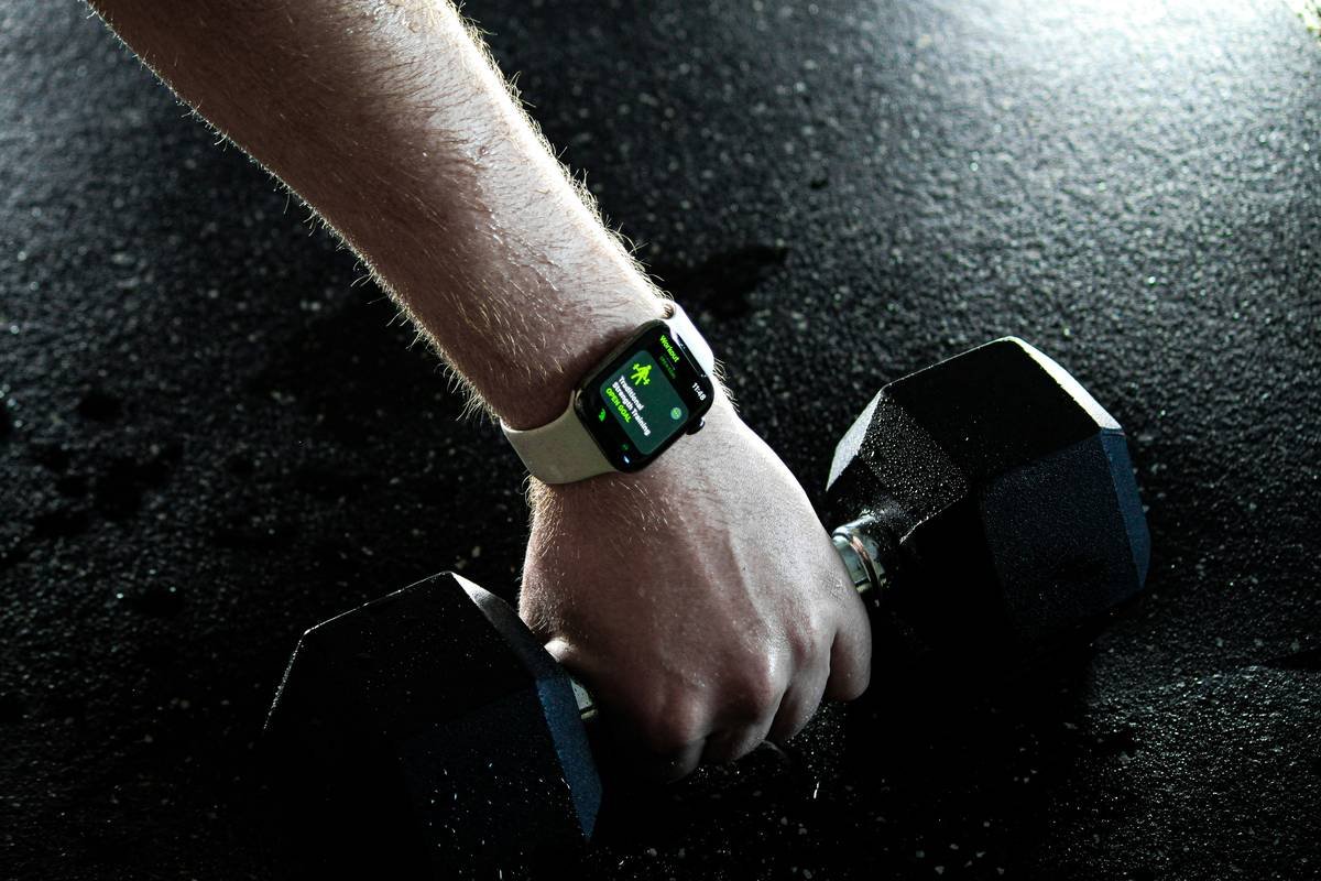 Bar chart showing user retention rates: 78% for simple-interface fitness watches vs. 42% for complex models after 90 days
