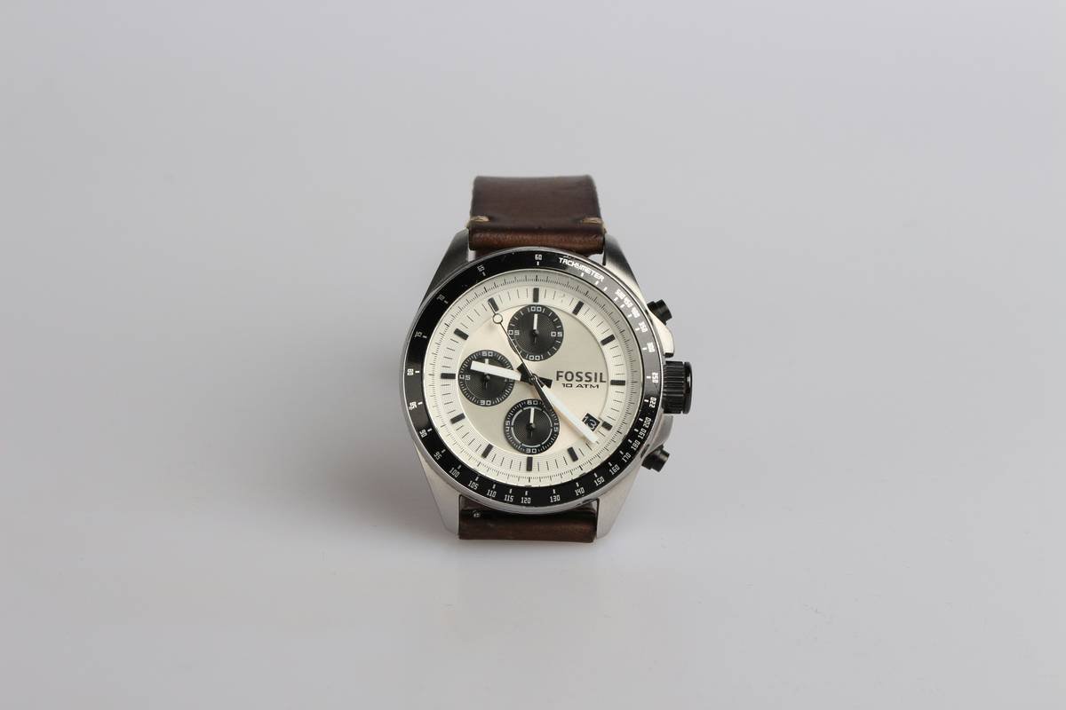 Comparison chart of 5 affordable designer watches for men showing movement type, case material, water resistance, and price