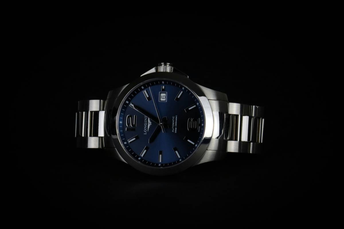 Side-by-side comparison of three affordable designer watches for women showing case materials, movement types, and retail prices under $300