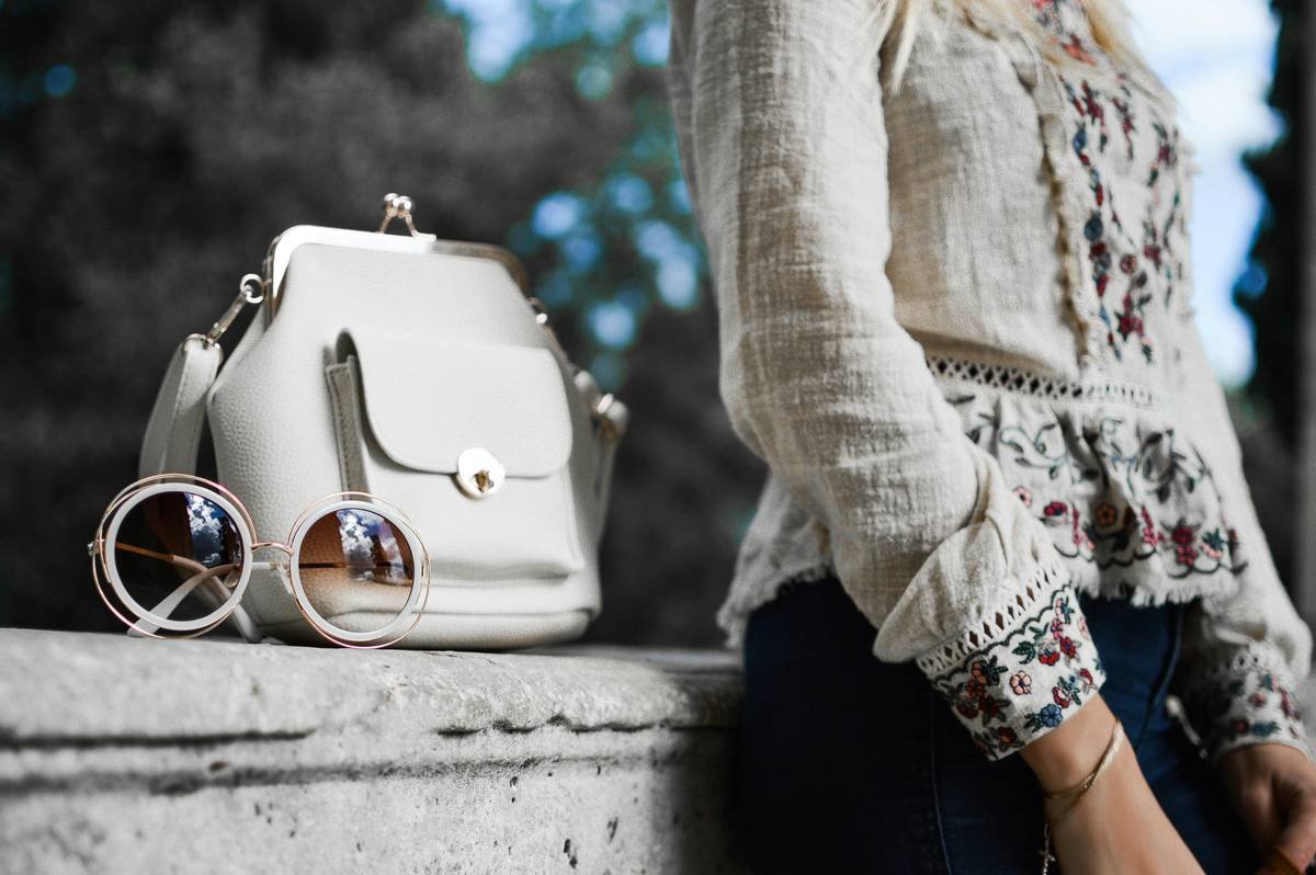 woman wearing a classic men's style watch with minimalist fashion outfit showcasing women watch men s fashion trends