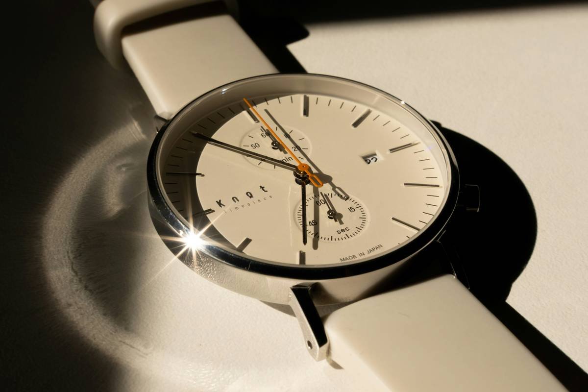 Infographic showing spectrum from minimalist to ornate watches with examples like MVMT minimalist vs. TAG Heuer Carrera
