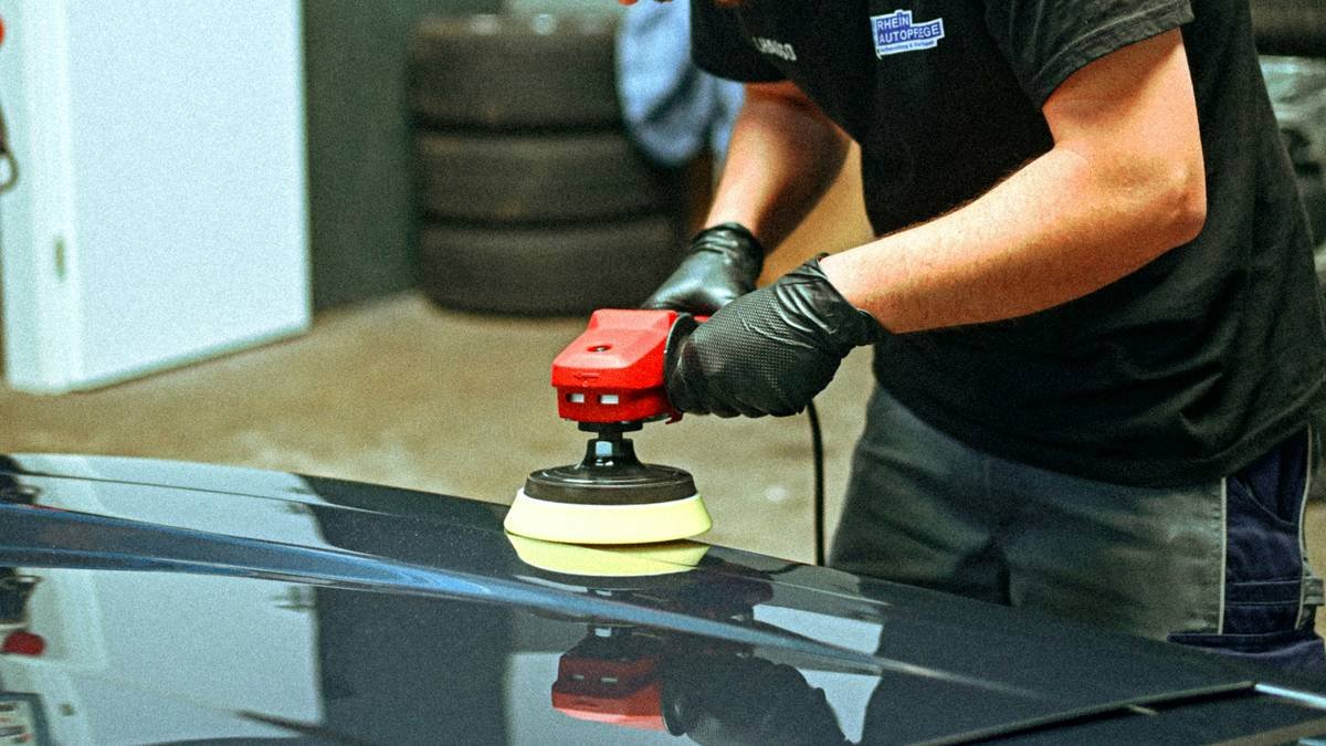 Close-up of titanium fashion watche being gently cleaned with soft brush